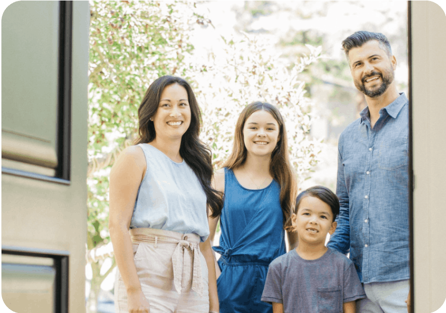 Family standing at their front door